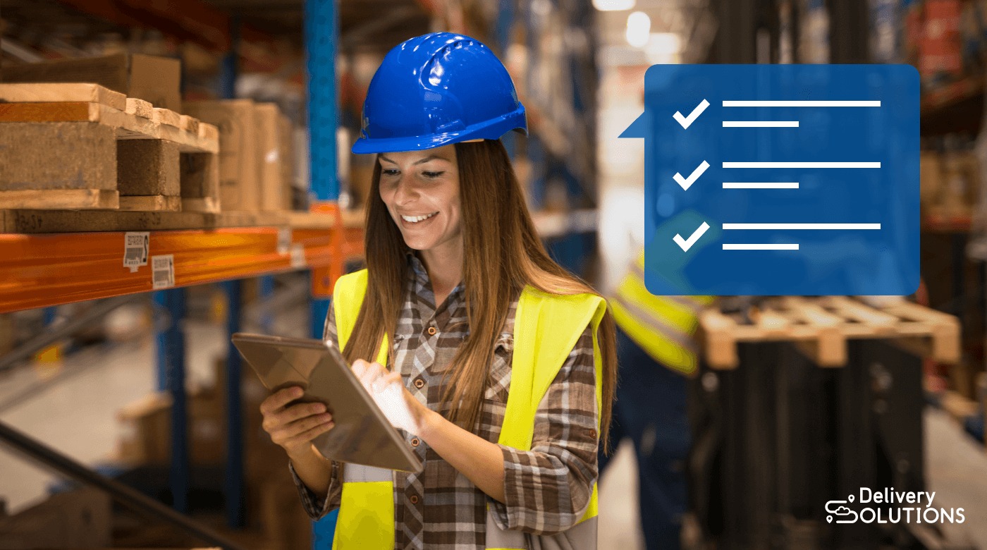 Employee checking warehouse inventory